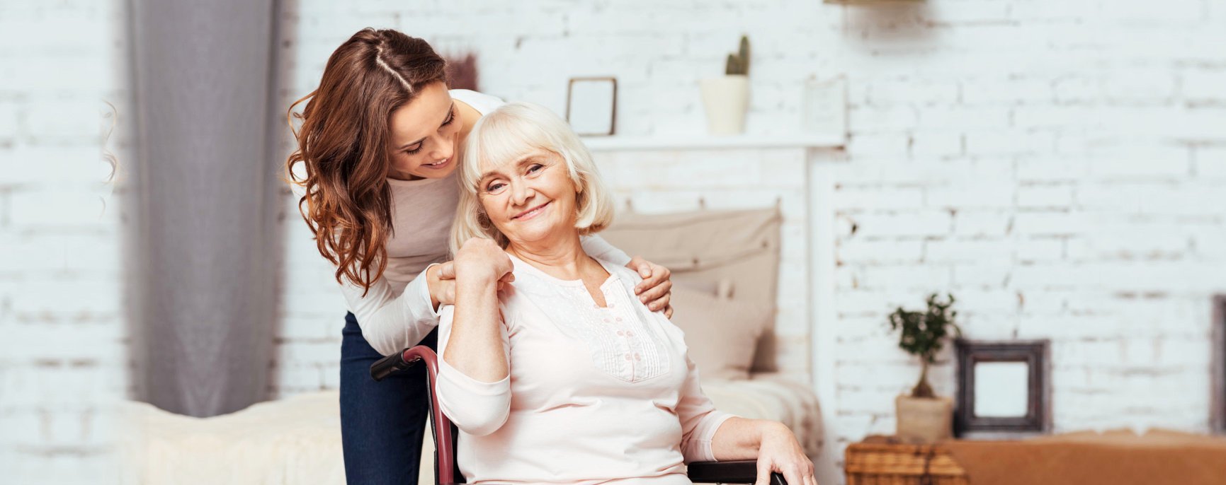 Caregiver smiling with an elderly
